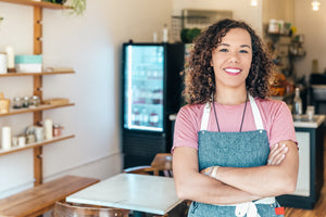 from_uk_a-barista-smiles-proudly-stood-in-her-cafe.jpg
