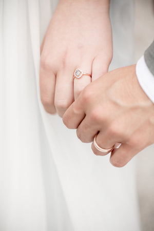 from_uk_newly-weds-hold-hands-close-up.jpg
