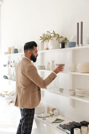 from_uk_young-man-looks-at-home-goods-in-store.jpg